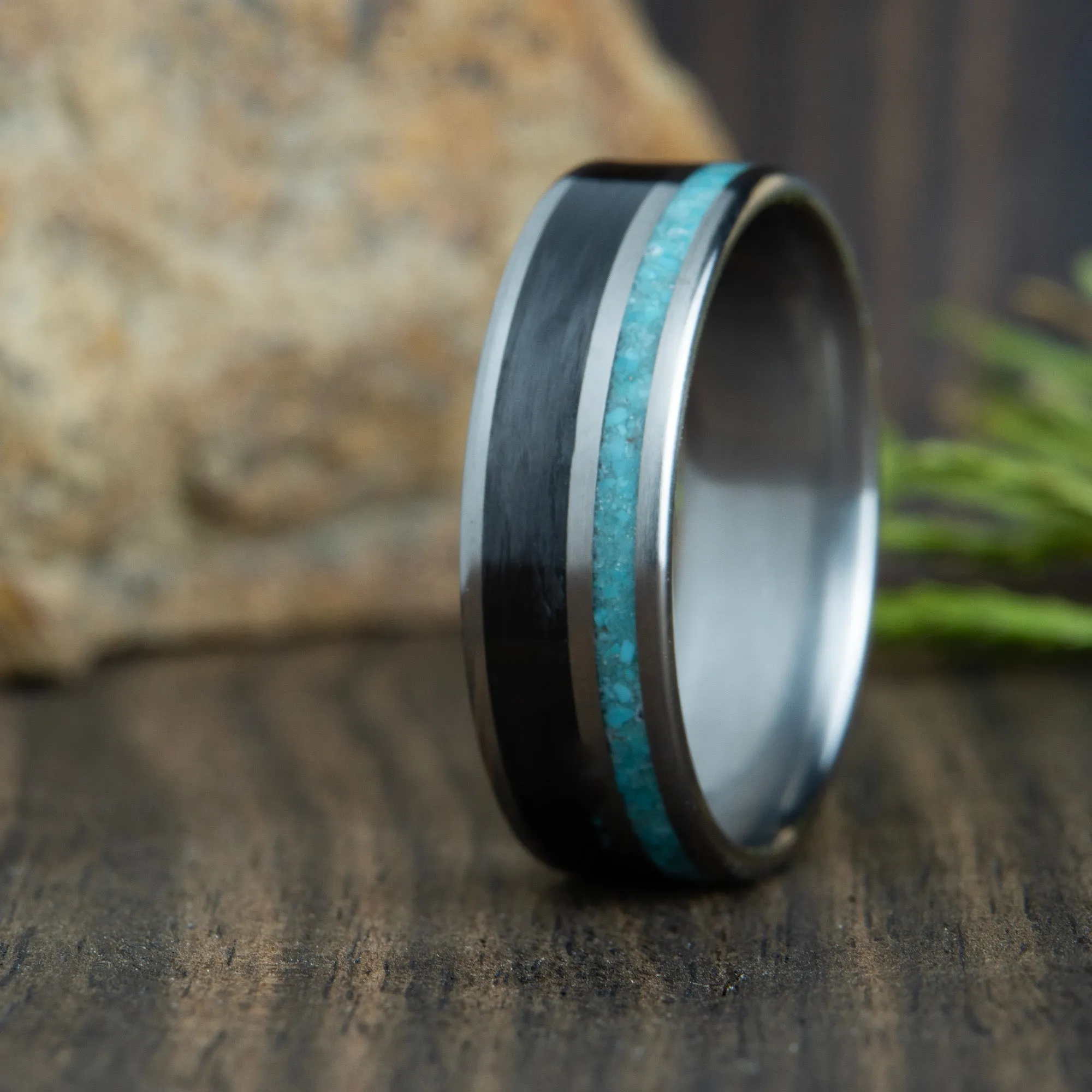 carbon fiber ring with turquoise